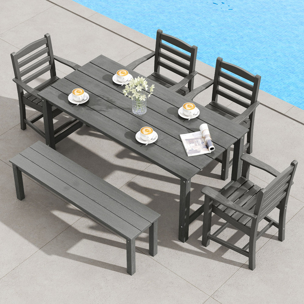 Patio dining set featuring a grey HDPE table and chairs, perfect for outdoor gatherings by the poolside.