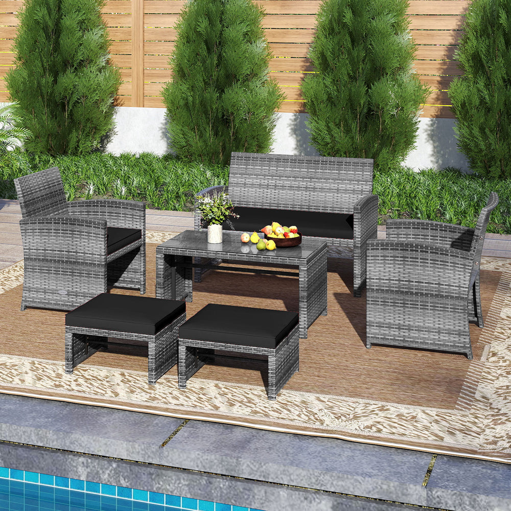 6-piece outdoor sectional sofa set in black PE rattan with cushions, ideal for patio relaxation and conversation.