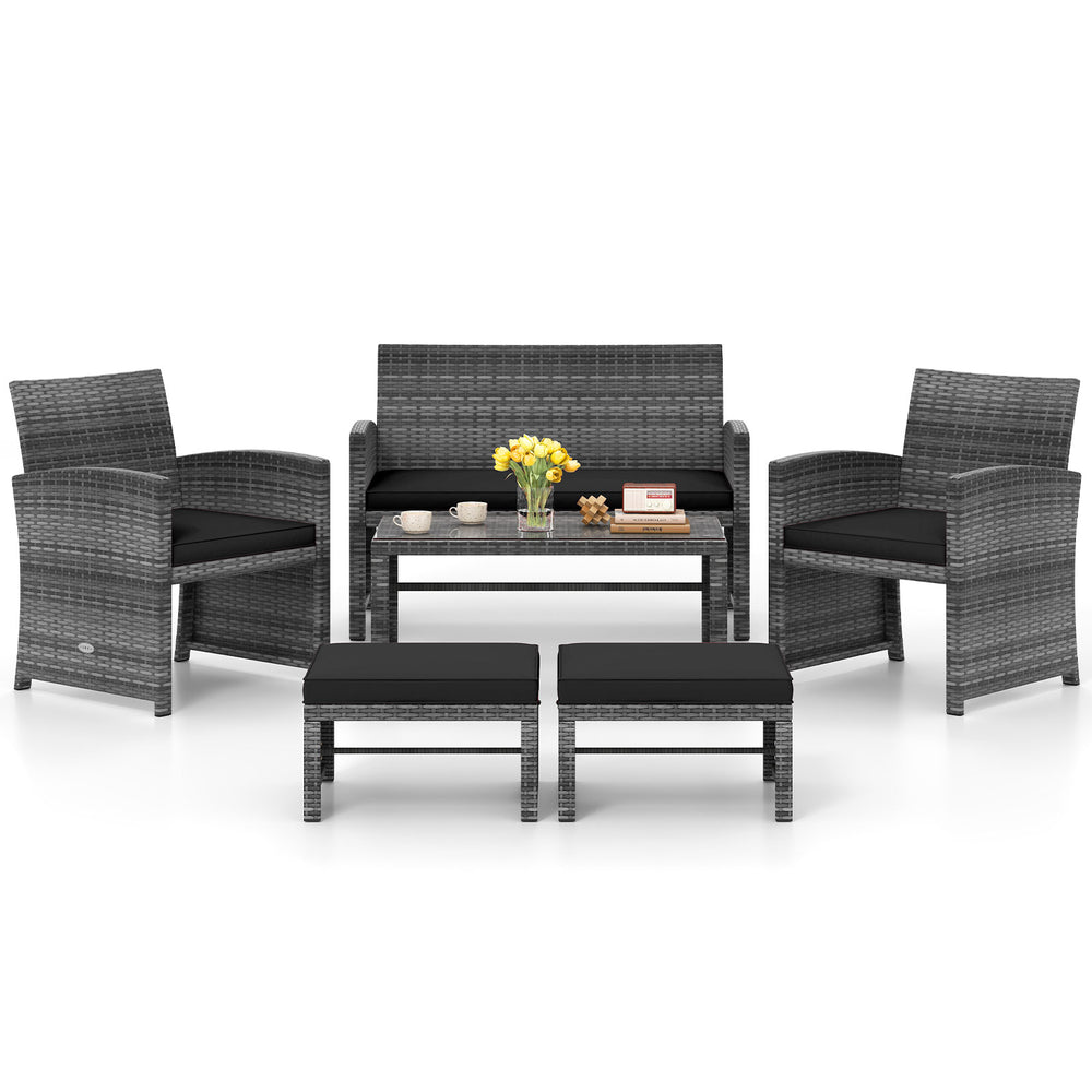 6-piece black PE rattan patio furniture set with soft cushions, including loveseat, chairs, coffee table, and ottomans.