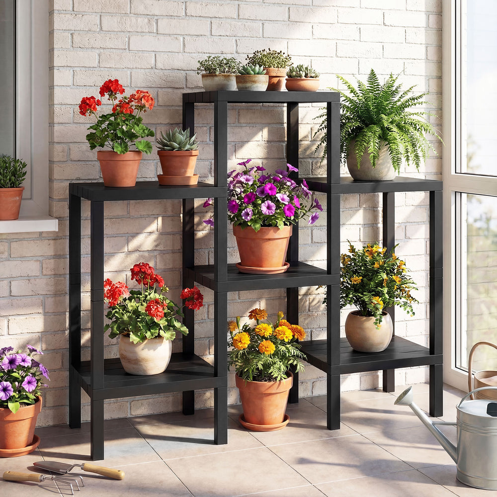 6-tier black plastic modular storage shelves with potted plants, ideal for living room or kitchen organization.