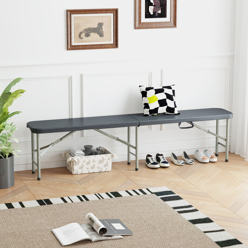 Gray 6-foot folding HDPE bench with wood-like texture, 1320 lbs capacity, ideal for picnics and outdoor events.