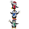 Three stacked penguins in Christmas hats and scarves, illuminated by cold white LED lights for festive yard decor.
