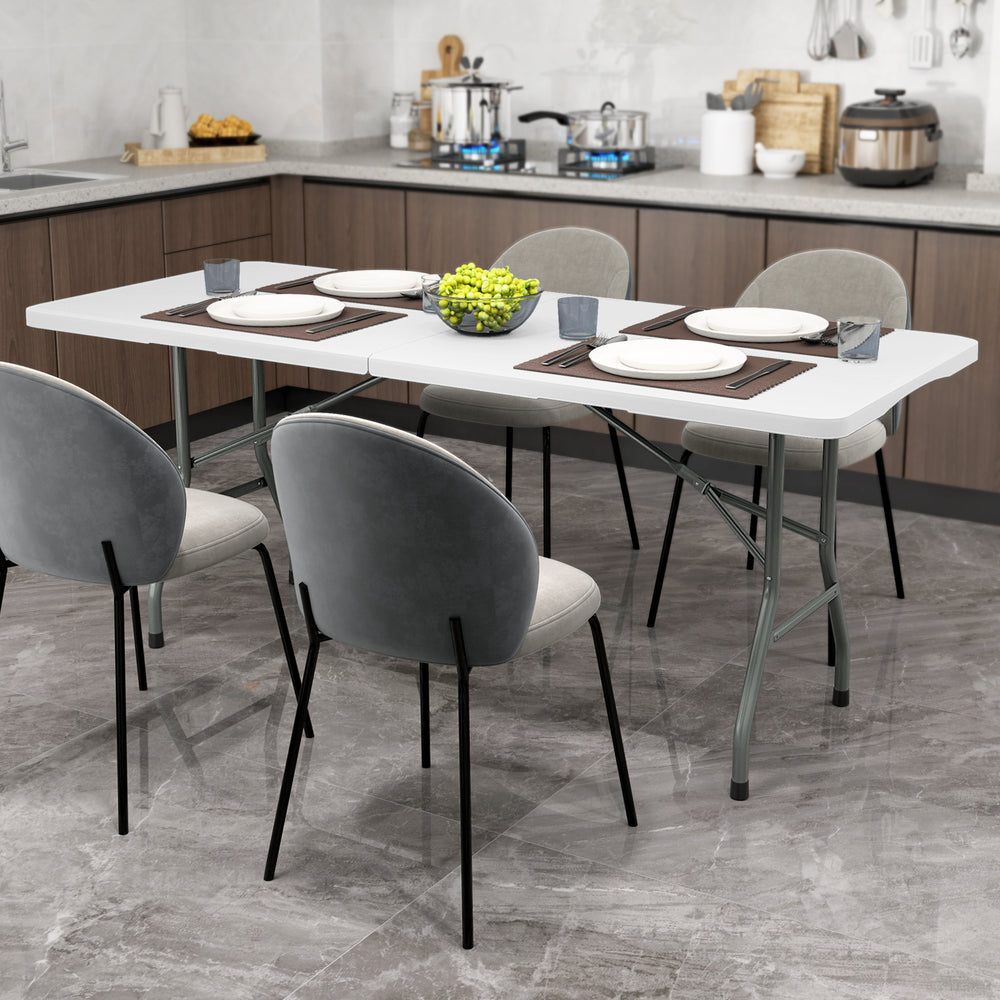 Portable 6 ft folding table with HDPE tabletop, supported by sturdy metal legs, ideal for indoor or outdoor use.