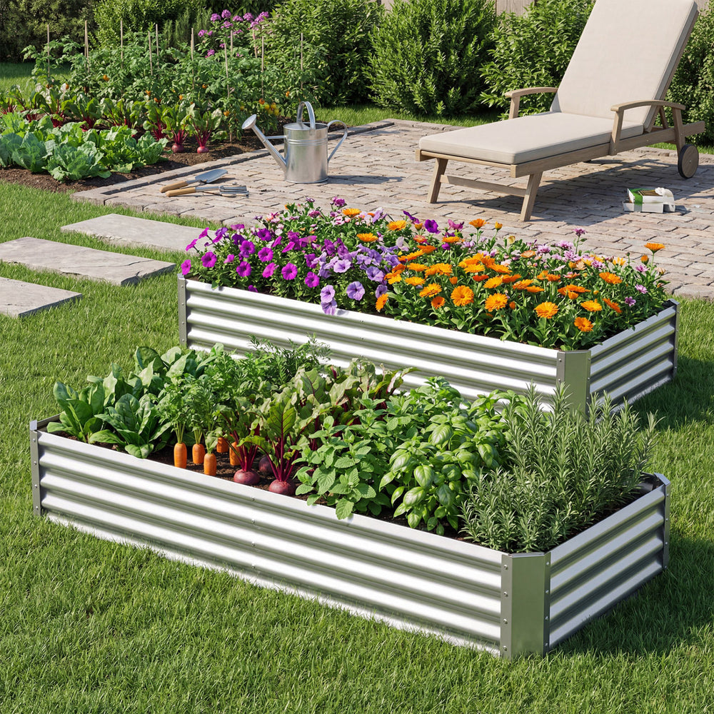 Galvanized raised garden bed with flowers and vegetables, featuring sturdy corrugated panels for outdoor planting.