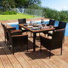 7-piece rattan patio dining set featuring a rectangular acacia wood table and 6 stackable chairs, ideal for outdoor use.