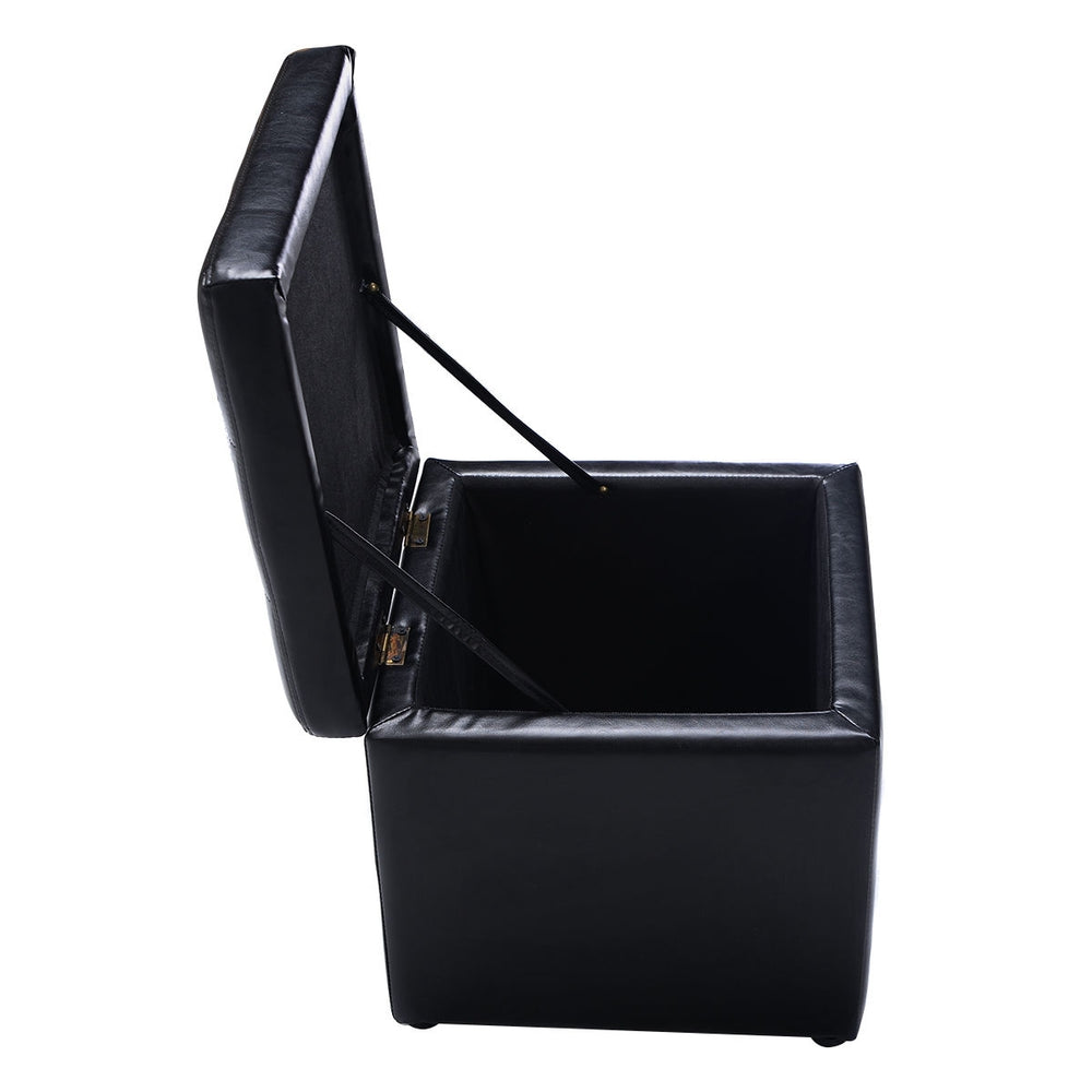 Black foldable cube ottoman pouffe with cushioned top and hinge design for storage of toys and accessories.
