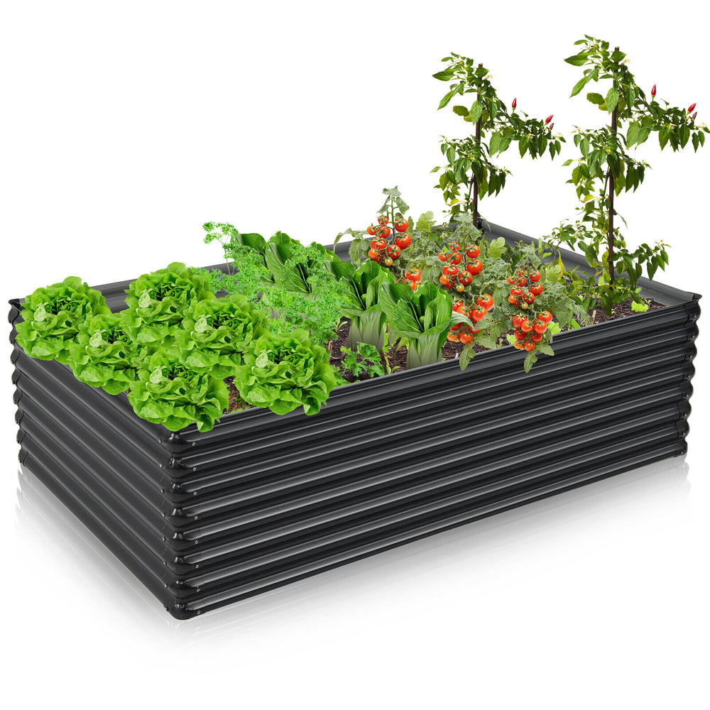 Galvanized metal raised garden bed in dark gray, featuring wave-shaped design and bottomless construction for plant.