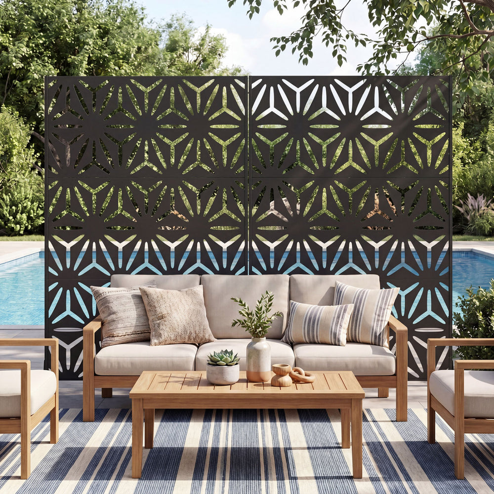 Freestanding black fence panel with hollow-carved design, enhancing privacy for patio or poolside use.
