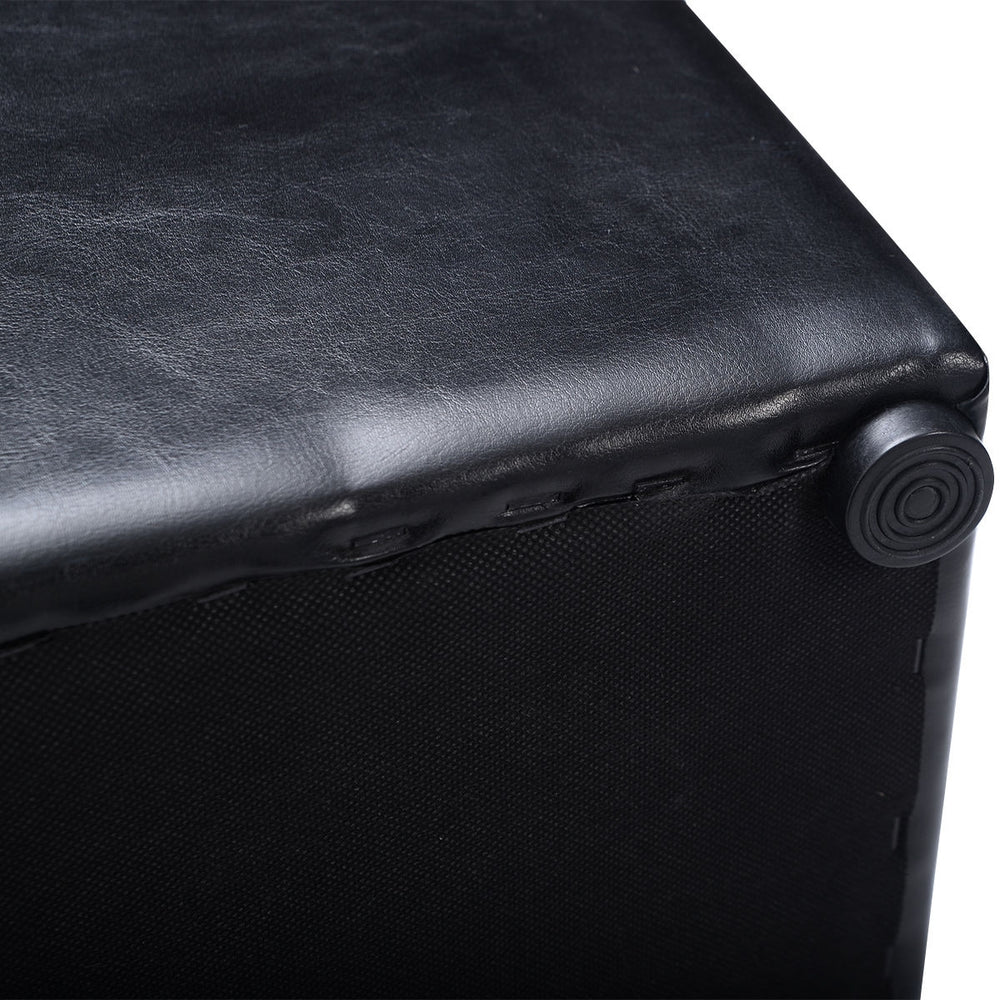 Black faux leather foldable cube ottoman pouffe with cushioned top, perfect for storage and seating.