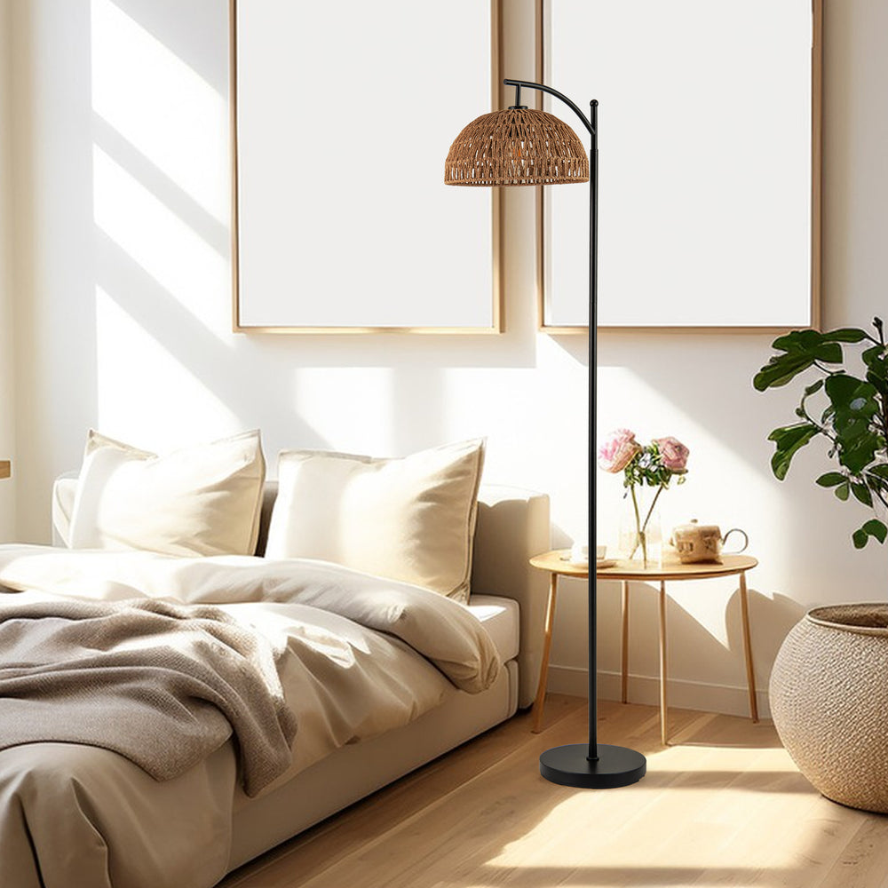 Arc floor lamp with a black pole and hanging rattan lampshade, ideal for living room or bedroom lighting.