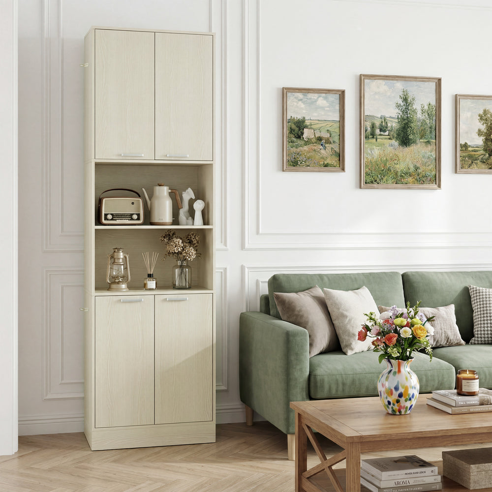 Tall beige kitchen pantry cabinet with doors and shelves, perfect for organizing kitchen essentials in a stylish living.
