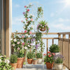 Elegant white metal garden trellis with a foldable bottom shelf, perfect for organizing climbing flowers and decorative pots.
