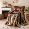 Soft plush fuzzy luxury faux raccoon fur blanket draped over a brown armchair, ideal for cozying up on sofas or beds.