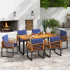 Navy cushion-accented acacia wood dining chair with stylish armrests, ideal for enhancing outdoor dining areas.