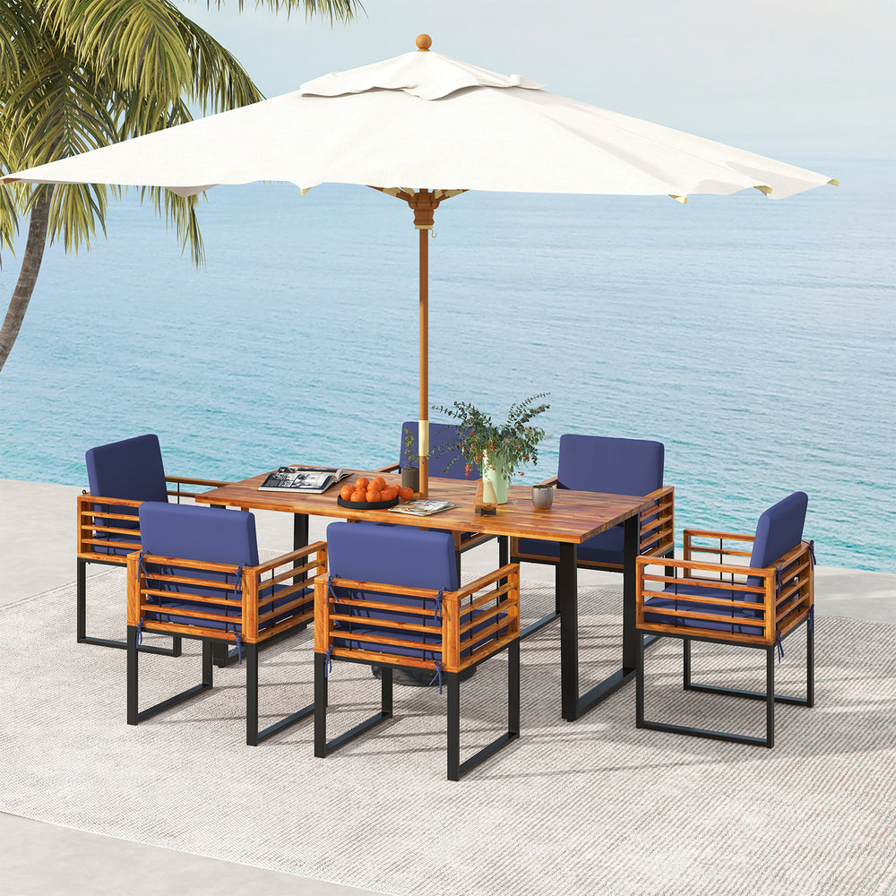 7-piece patio dining set featuring acacia wood table and navy cushions, perfect for backyard and poolside relaxation.
