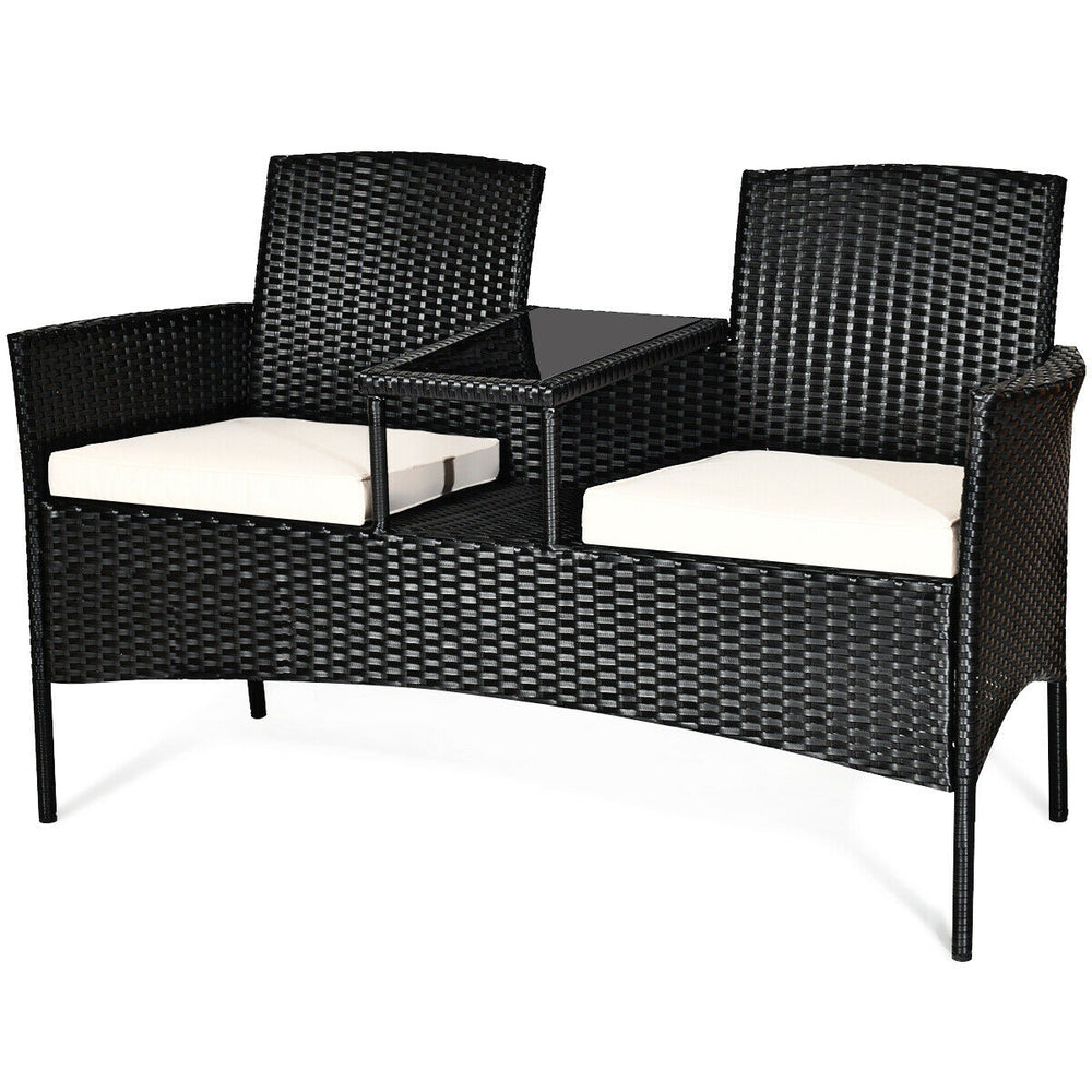 Wicker patio conversation set featuring a durable steel frame, removable cushions, and a tempered glass table, ideal.