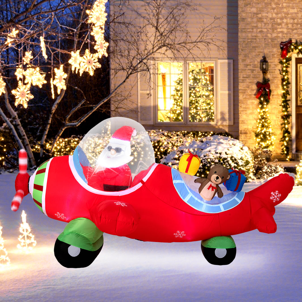 Christmas inflatable airplane featuring Santa Claus, a bear, and gift boxes, with built-in LED lights for outdoor.