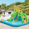 Inflatable water park with climbing wall, double slides, splash pool, and water cannon for outdoor summer fun.
