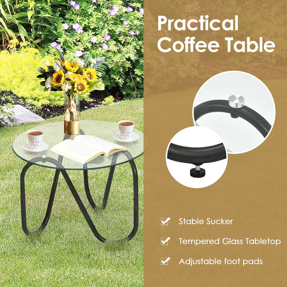 Tempered glass coffee table with adjustable foot pads, perfect for patio or garden use alongside wicker chairs.