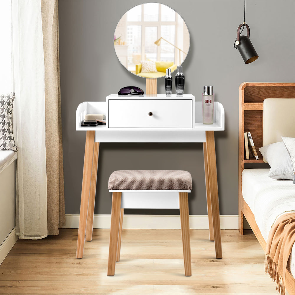 Wooden makeup dressing table set with round mirror, adjustable height, and soft cushioned stool for stylish home decor.