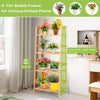 4-tier bamboo plant rack with guardrails, featuring a stable trapezoidal structure for organizing potted plants indoors.