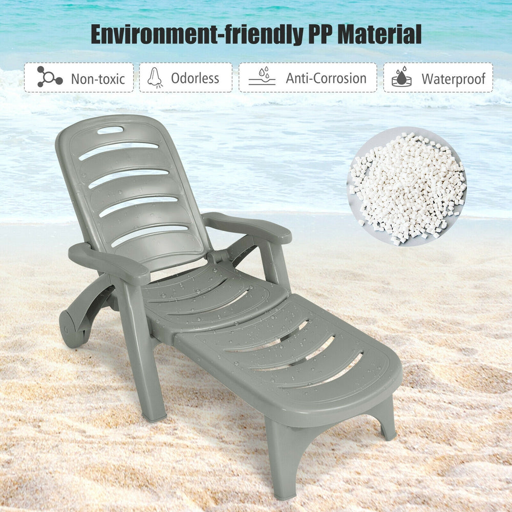 Gray 5-position adjustable folding lounger chaise chair with armrests, ideal for outdoor relaxation by the poolside.