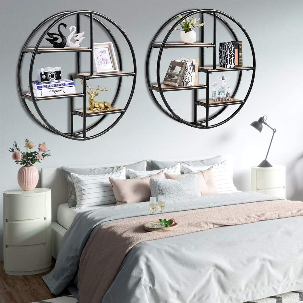Circular wall-mounted 4-tier rack in black metal, perfect for displaying decor in modern minimalist rooms.