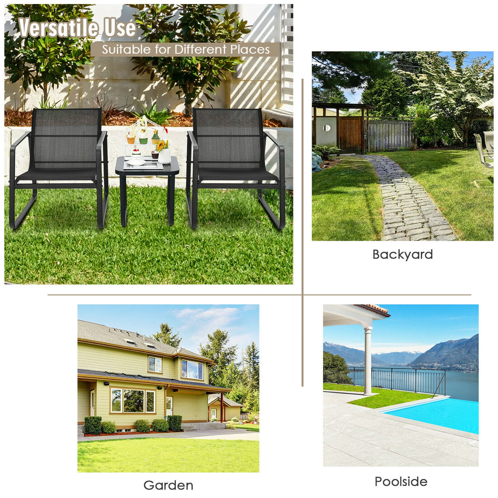 Two ergonomic black chairs with a glass top table, perfect for outdoor relaxation in the backyard or poolside.