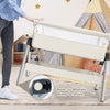 Portable baby bedside sleeper with adjustable height, angle, and built-in wheels for easy mobility and comfort.