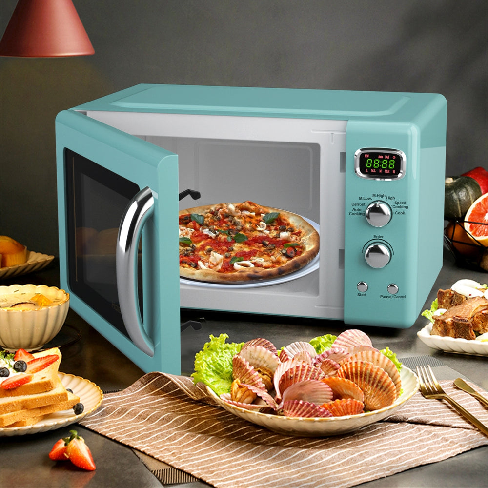 Compact 0.9 Cu.ft retro microwave oven in green with a glass turntable, ideal for small spaces and easy operation.