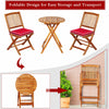 Patio folding bistro set with red cushioned chairs and round acacia wood table, designed for easy storage and transport.