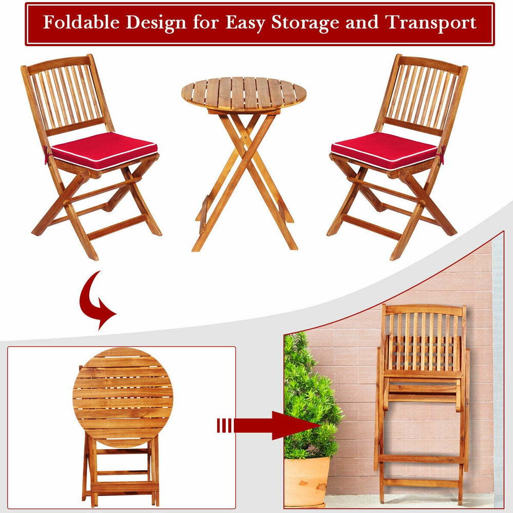 Patio folding bistro set with red cushioned chairs and round acacia wood table, designed for easy storage and transport.