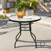 Black steel round table with a 32-inch tempered glass top, perfect for outdoor meals, featuring an umbrella hole for.