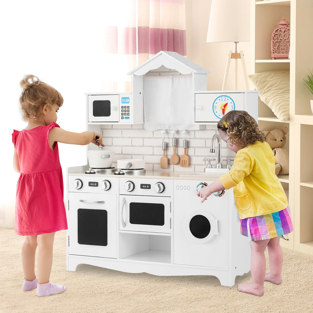 Wooden kids kitchen playset featuring a washing machine, oven, and accessories for imaginative play and creativity.