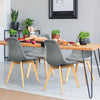 Modern dining chair set with wood legs and fabric cushions, featuring ergonomic design for comfort in a stylish dining.