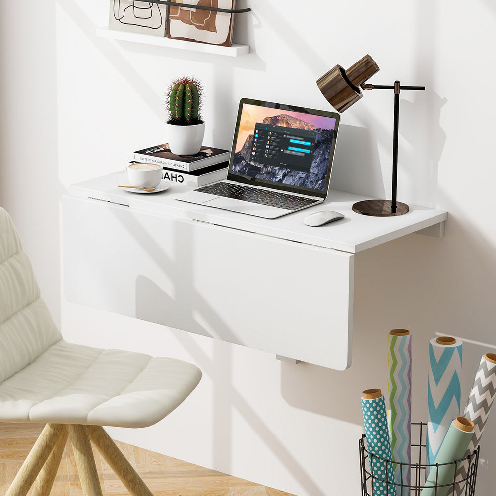Wall mounted folding table in sleek white finish, perfect for small spaces, ideal for dining or workspace use.