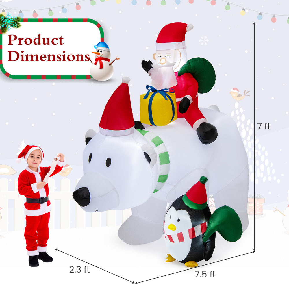Inflatable Santa Claus riding a polar bear with a penguin, featuring LED lights, for festive outdoor decoration.