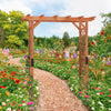 7 feet wooden high arbor arch with lattice panels, perfect for supporting climbing plants in a vibrant garden setting.