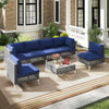 7-piece outdoor furniture set with navy cushions, featuring PE rattan chairs and tempered glass coffee table for patio.