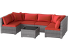 L-shaped 7-piece PE rattan patio set in red with soft cushions and tempered glass table, ideal for outdoor relaxation.