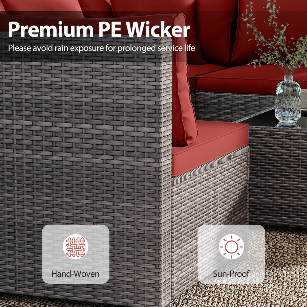 Hand-woven red PE rattan corner of the 7-piece patio set with soft cushions, ideal for outdoor relaxation.