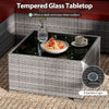 Tempered glass tabletop with 4 suction cups on a hand-woven PE rattan coffee table for outdoor patio use.