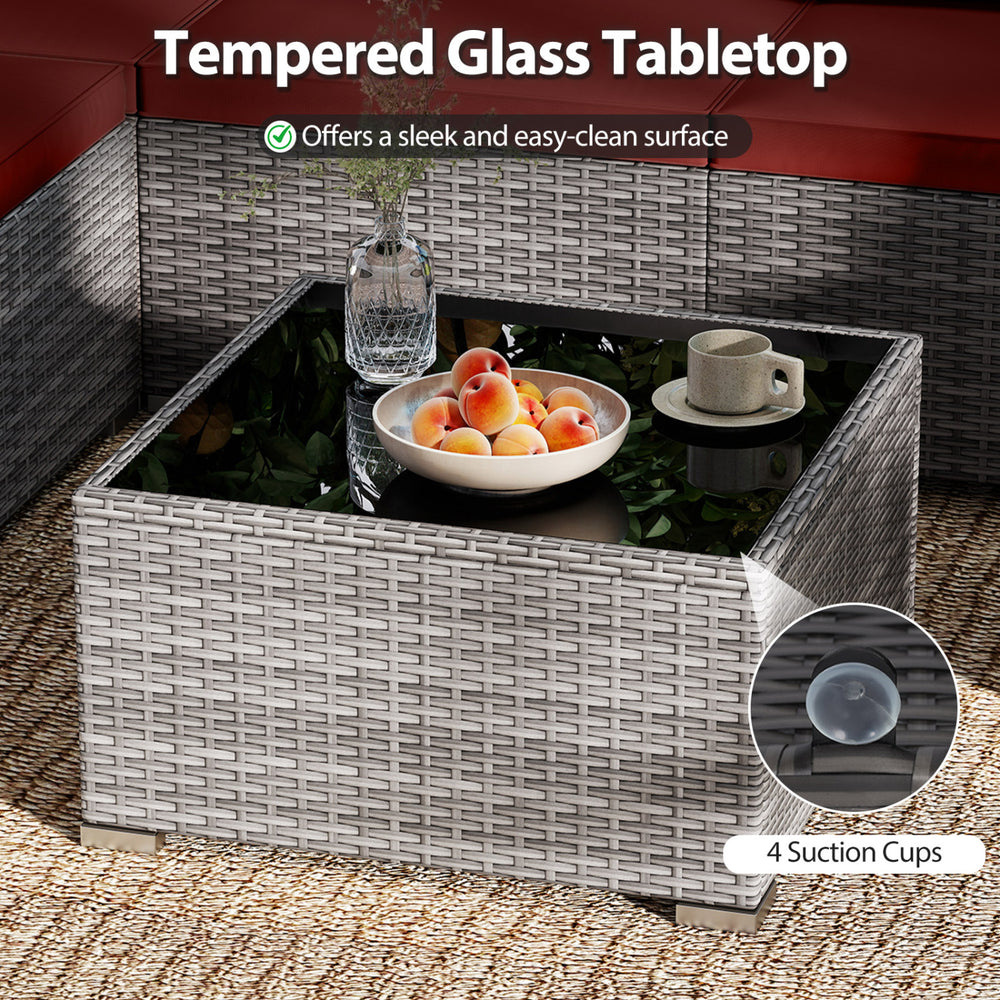Tempered glass tabletop with 4 suction cups on a hand-woven PE rattan coffee table for outdoor patio use.