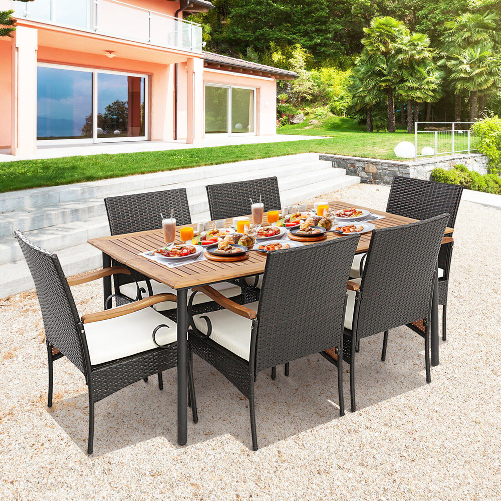 7-piece patio wicker dining set featuring acacia wood table, detachable cushions, and umbrella hole for outdoor dining.