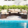 Curved 7-piece patio furniture set in brown PE rattan with cushions, ideal for poolside relaxation and outdoor use.