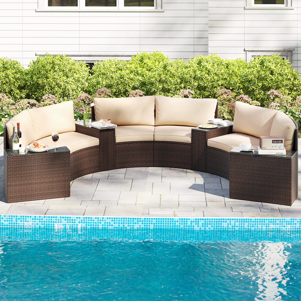 Curved 7-piece patio furniture set in brown PE rattan with cushions, ideal for poolside relaxation and outdoor use.