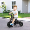 Toddler riding the 7-in-1 gray stroller tricycle with adjustable canopy and foldable footrests in a sunny outdoor.