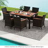 7-piece garden dining patio rattan set with acacia wood table and cushions, perfect for backyard gatherings.
