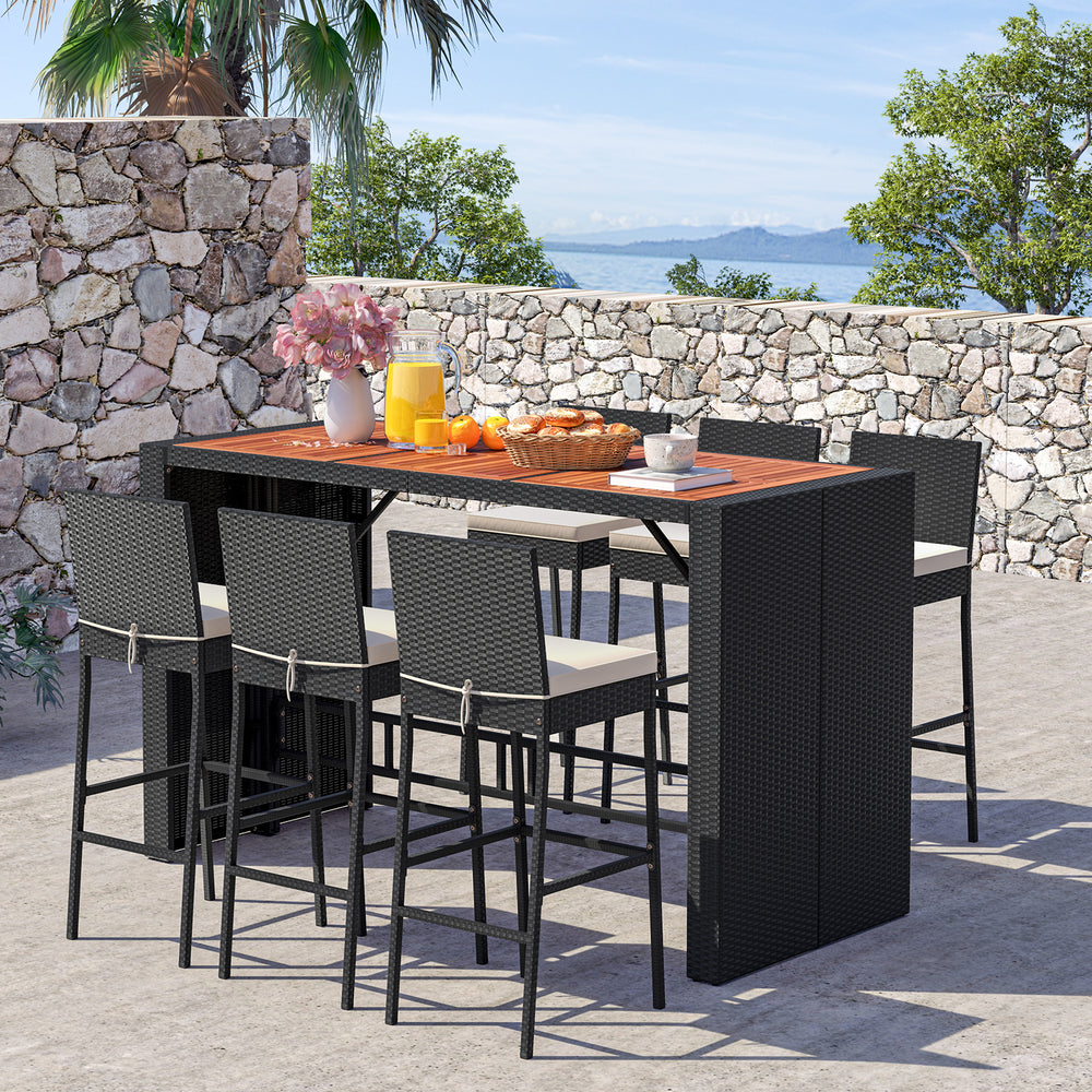7-piece patio rattan bar set with acacia wood tabletop and seat cushions, perfect for outdoor dining in the garden.