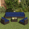 Sectional patio rattan furniture set in navy with cushions, including coffee table, ideal for outdoor relaxation.